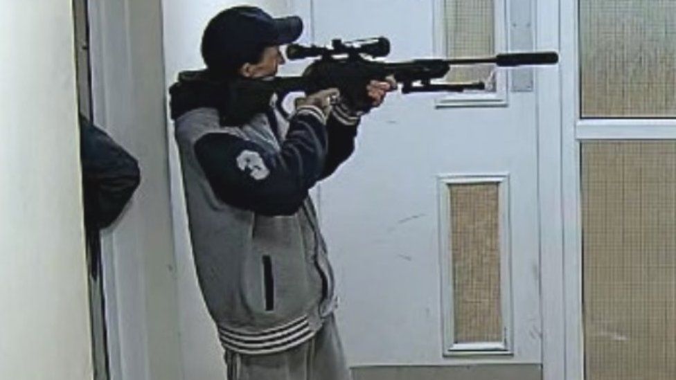 Man with air rifle