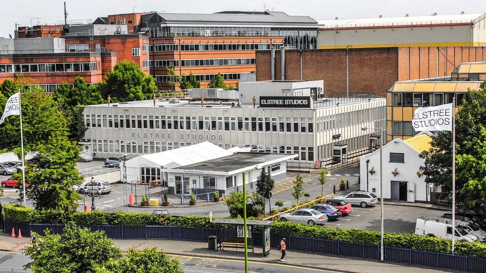 Four-storey brick-built studio buildings alongside a main road