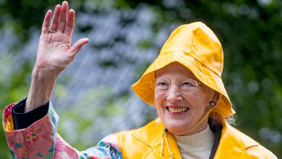 Danish queen wearing yellow hat