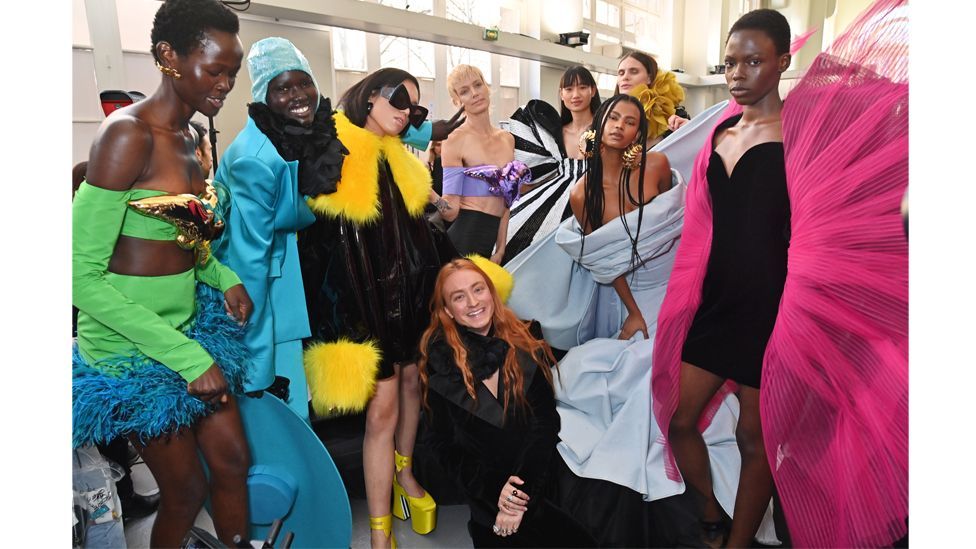 Reed poses with models backstage at the Nina Ricci autumn/winter 2023-24 show in Paris – he was made creative director of the fashion house at the age of 26 (Credit: Getty)
