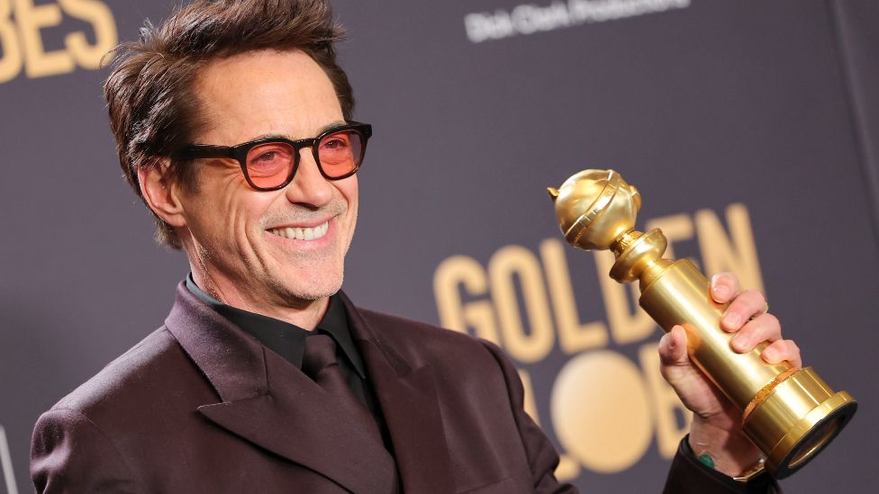 Robert Downey Jr. poses with the award for Best Performance by a Male Actor in a Supporting Role in any Motion Picture for "Oppenheimer" at the 81st Golden Globe Awards held at the Beverly Hilton Hotel on January 7, 2024 in Beverly Hills, California