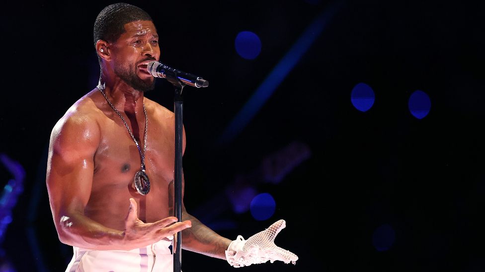Usher performs on the field during the Apple Music Super Bowl LVIII Halftime Show at Allegiant Stadium on February 11, 2024 in Las Vegas, Nevada