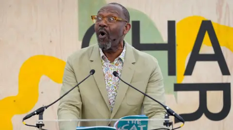 Reuters Sir Lenny Henry reading at a festival