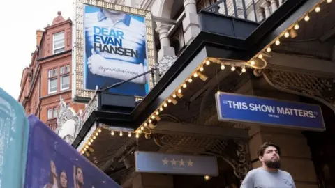 Getty Images Adverts for Dear Evan Hansen outside the Noel Coward Theatre on St. Martin's Lane in Theatreland, London.