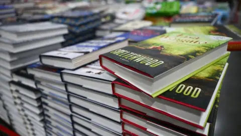 Getty Images Stacks of books are displayed for sale inside a store in Inglewood, California.