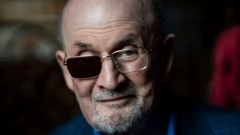 Getty Images A photo of Salman Rushdie wearing an eye patch after he lost an eye due to a stabbing incident.