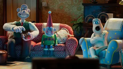 BBC/Aardman Animations/Richard Davies/Stuart Collis Wallace and Gromit characters sitting on a sofa in front of a television