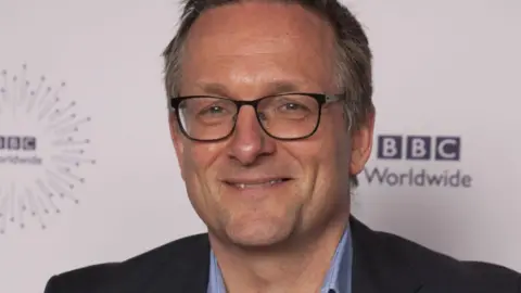 BBC/PA Media Michael Mosley smiling while wearing glasses