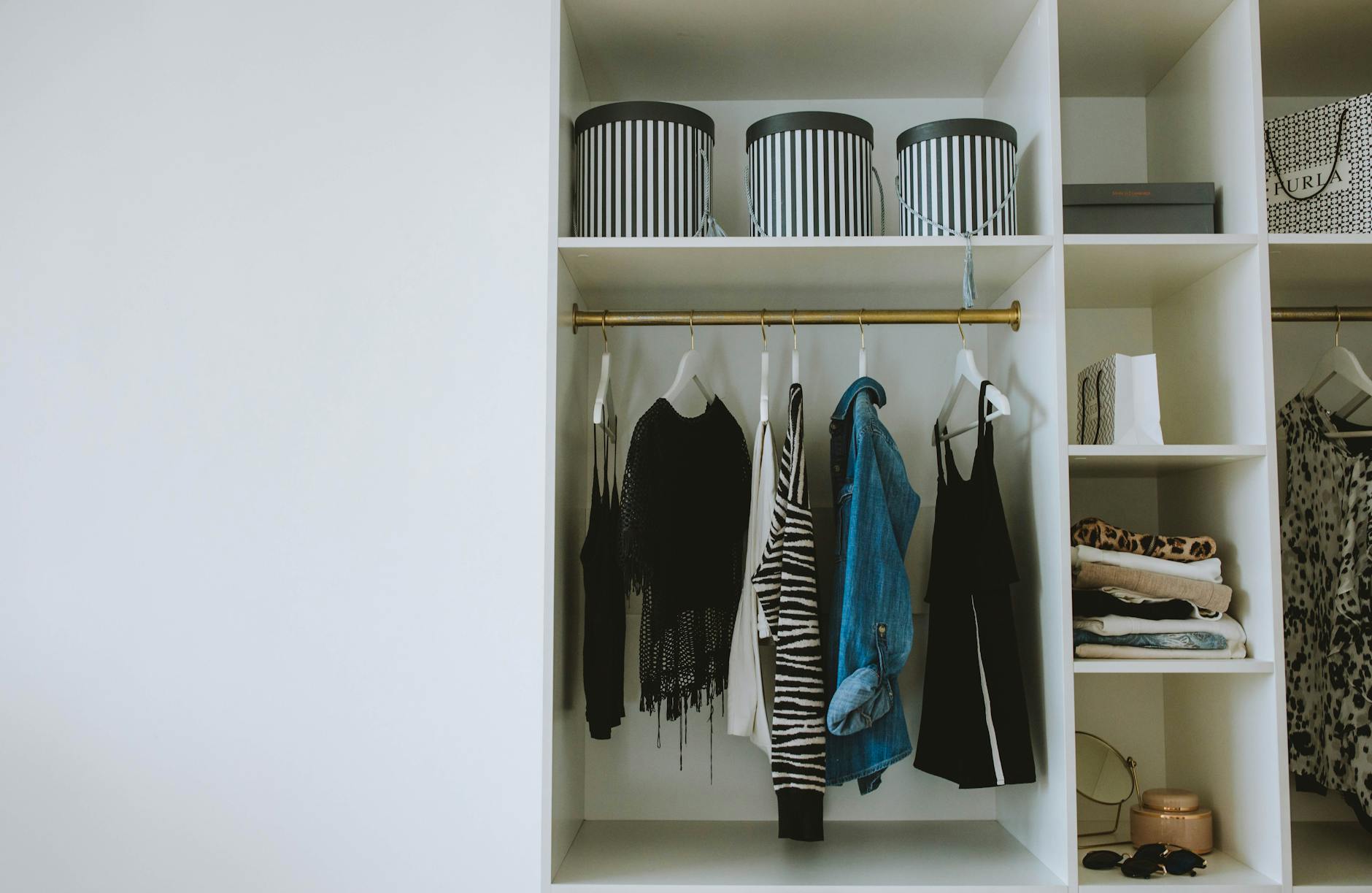 Professional business clothes hanging in organized closet wardrobe