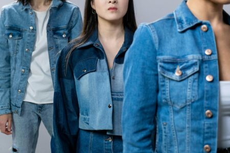 How Upcycled Denim Jackets Became This Year’s Must-Have Investment Piece Vintage denim jacket laid flat showing classic trucker style design