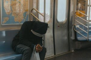 Person reading on public transportation during morning commute