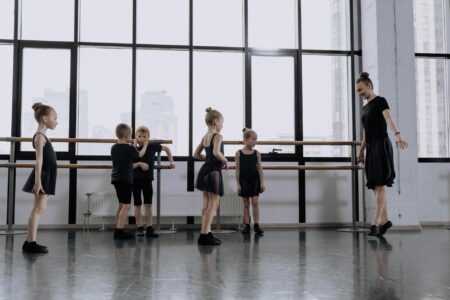 Modern dance studio with mirrors and wooden floors during a fitness class