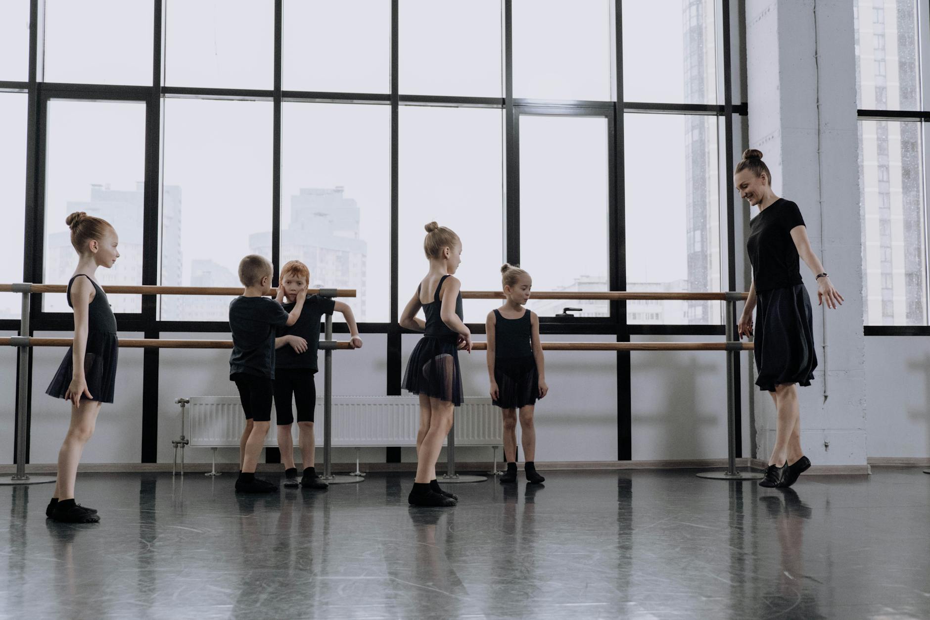 Modern dance studio with mirrors and wooden floors during a fitness class