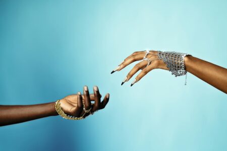 Person wearing a sleek smart ring on their finger, showing the minimalist design of modern sleep tracking wearables