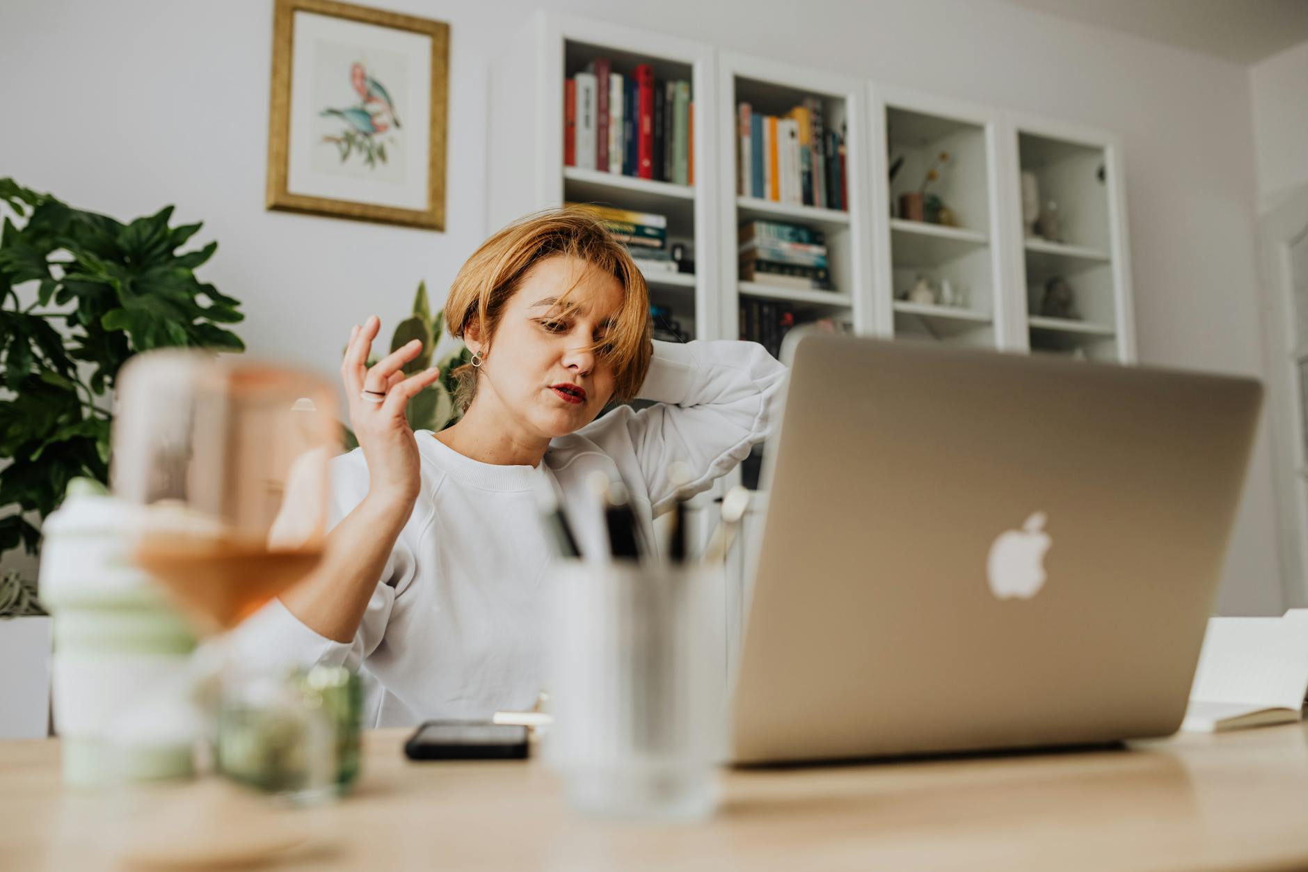 Stressed person working on laptop representing creator burnout and digital work pressure