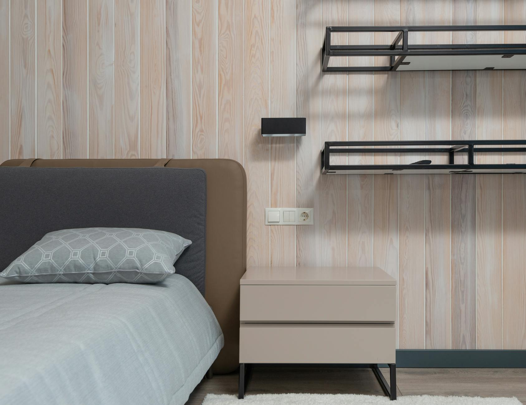 Modern wooden nightstand with clean lines and minimalist design in contemporary bedroom setting