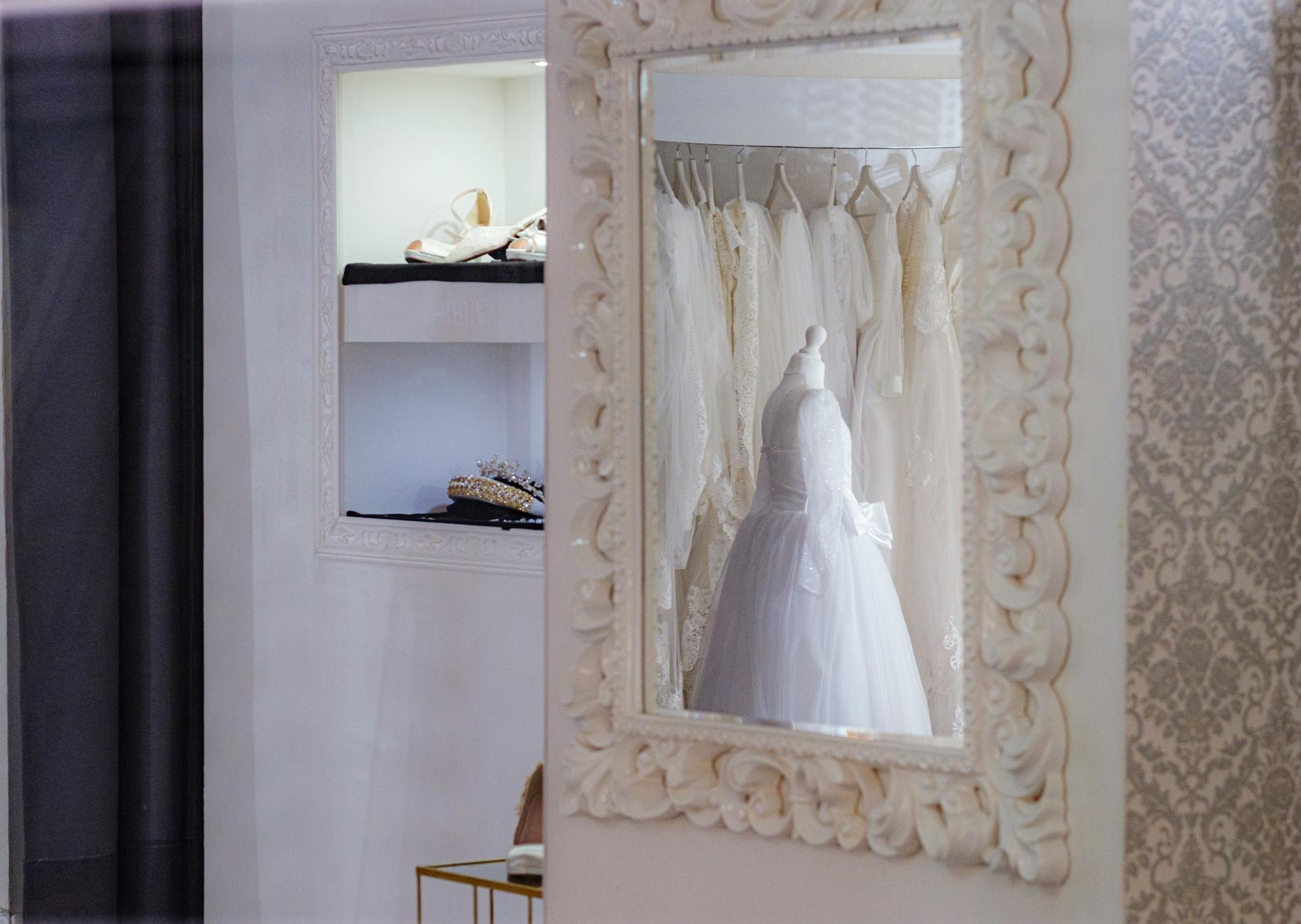 Modern luxury fashion boutique interior with neutral clothing displays and minimalist design