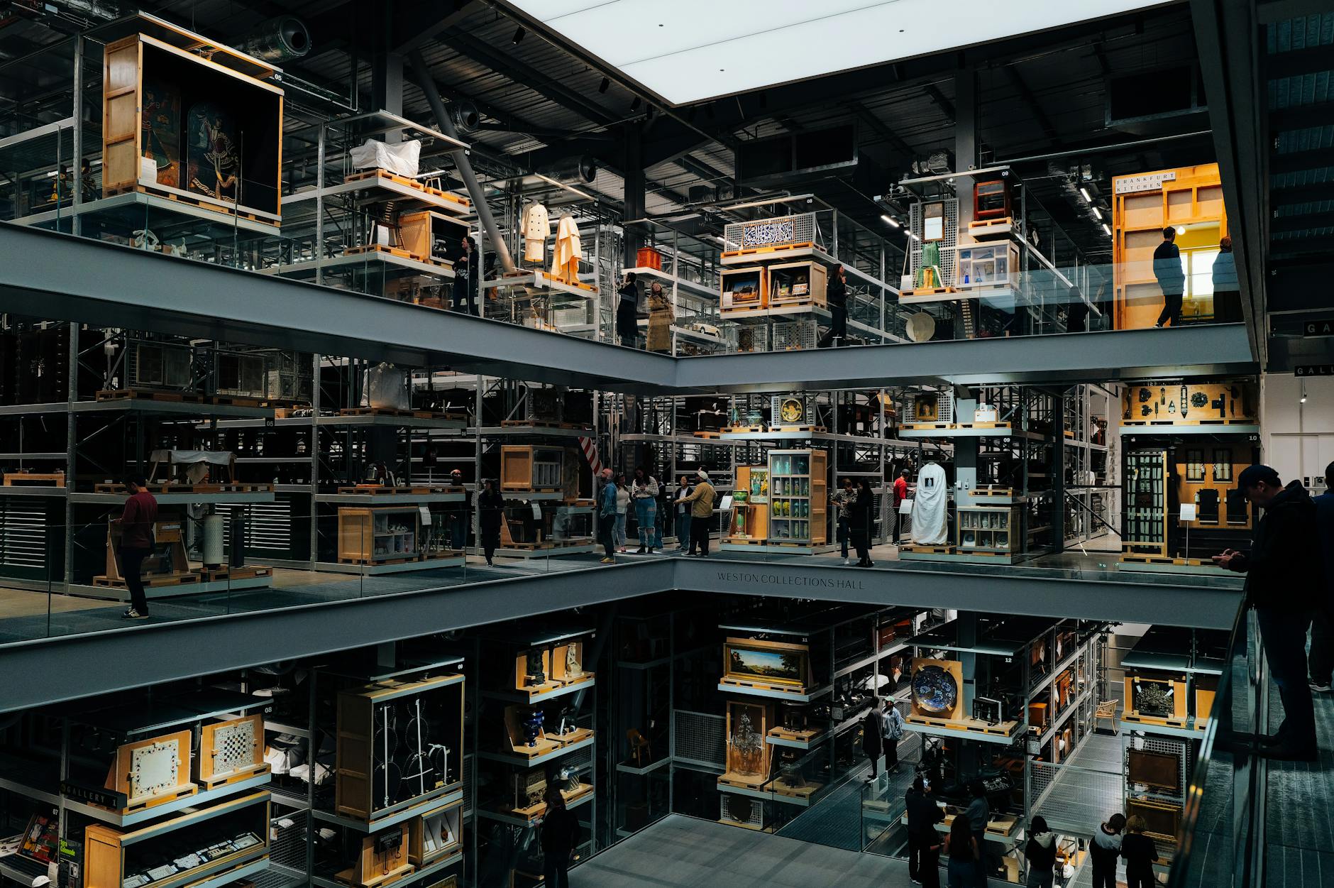 Modern museum gallery space with white walls and contemporary art installations during evening lighting