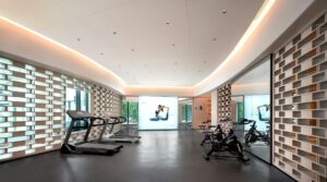Modern home gym interior with exercise equipment and mirrors