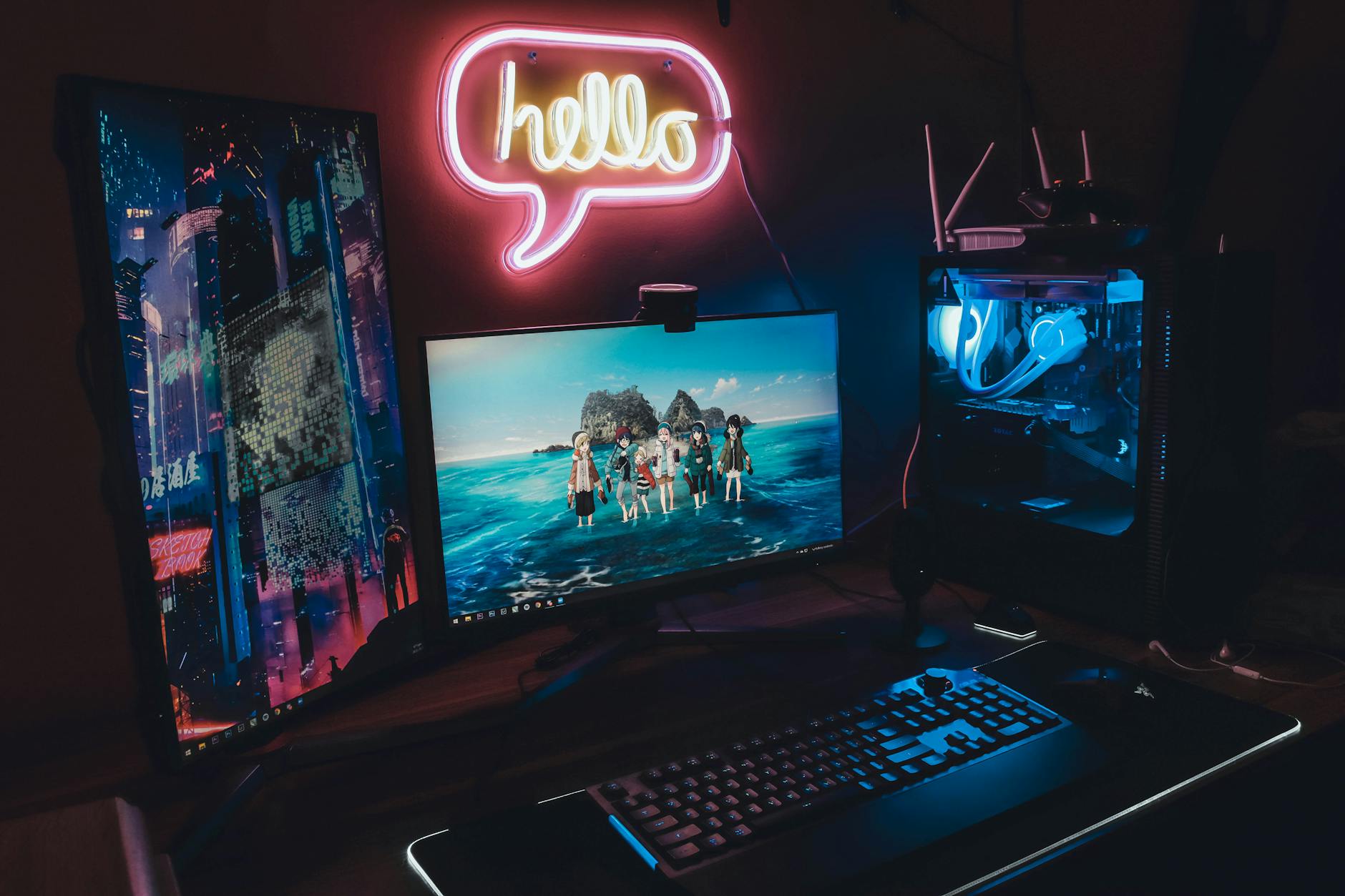 Modern gaming computer setup with multiple monitors displaying chat interfaces