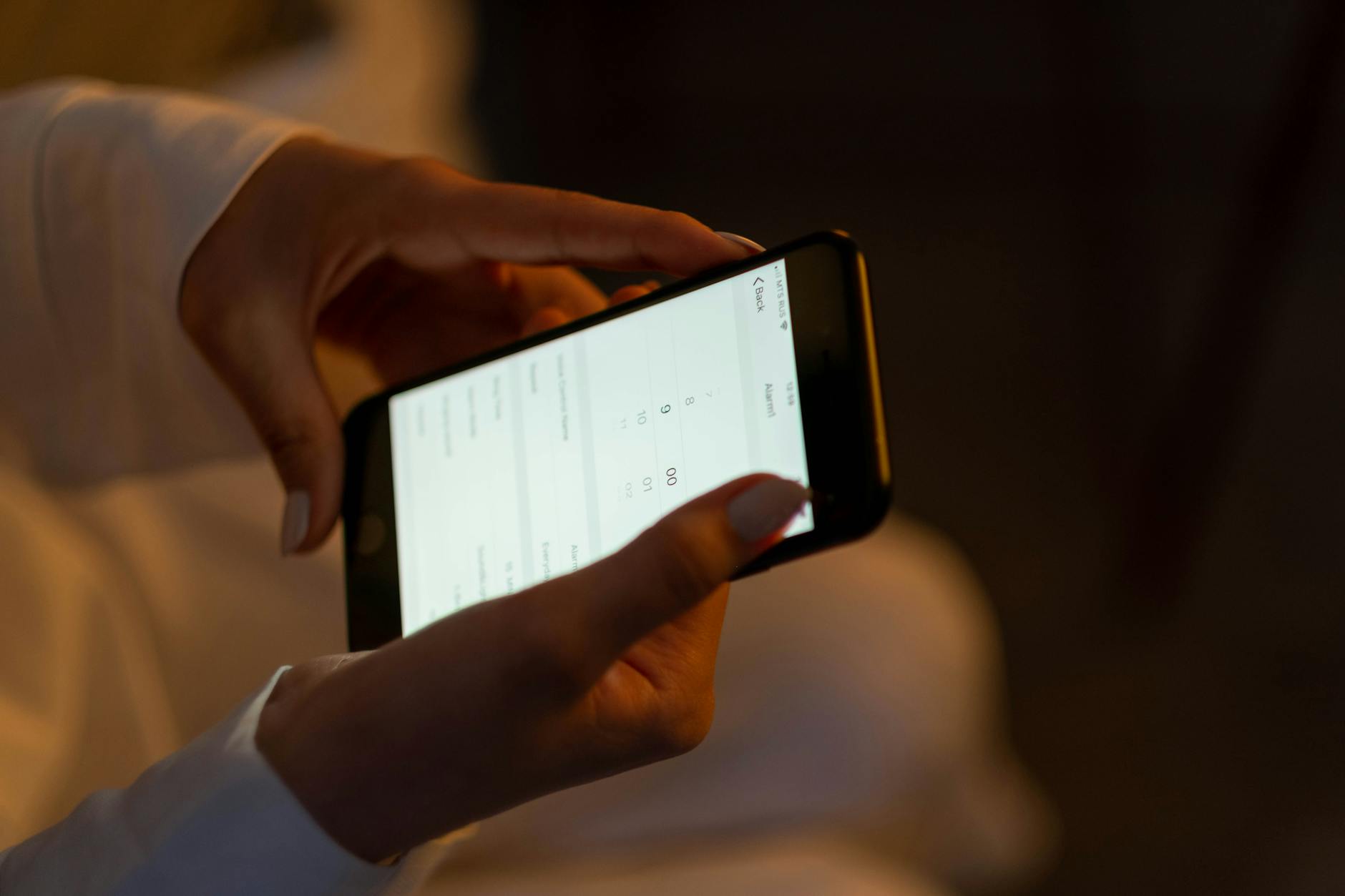 Person using meditation app on smartphone in peaceful setting