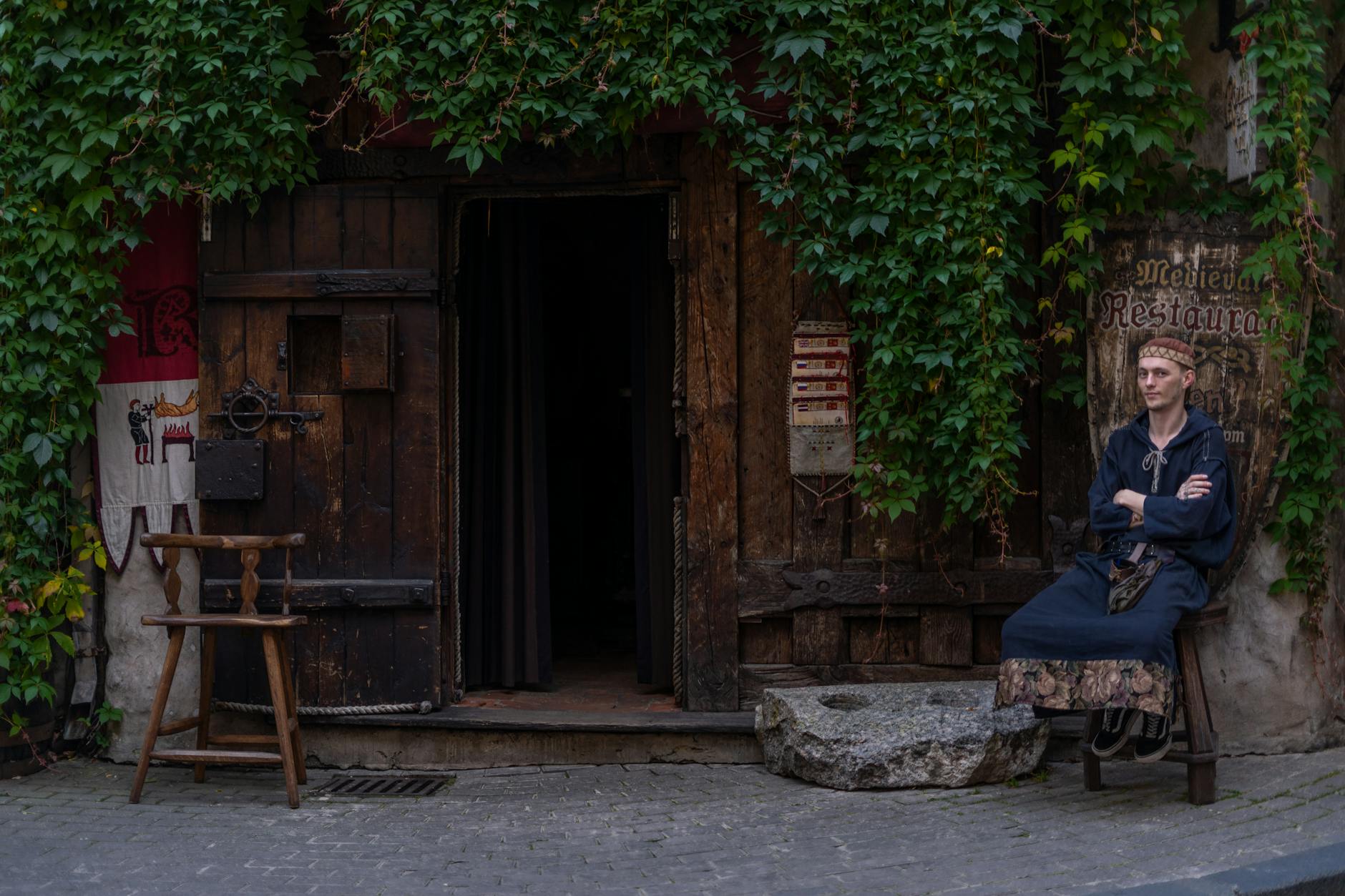 People in Renaissance period costumes at outdoor festival gathering