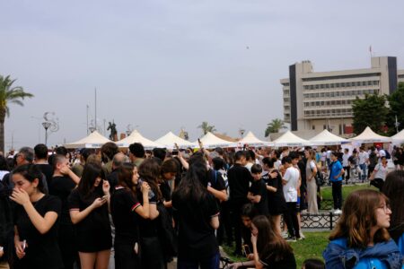 How Documentary Films Are Outselling Hollywood Blockbusters at Festivals Audience watching film screening at festival venue with theatrical lighting