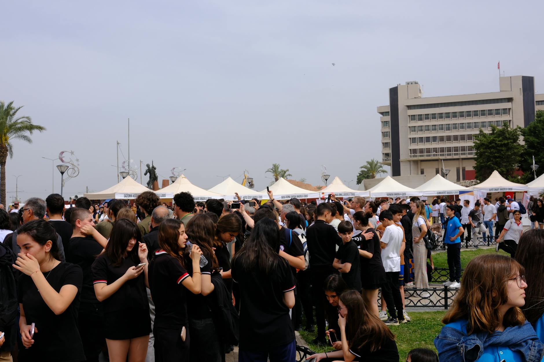 Audience watching film screening at festival venue with theatrical lighting