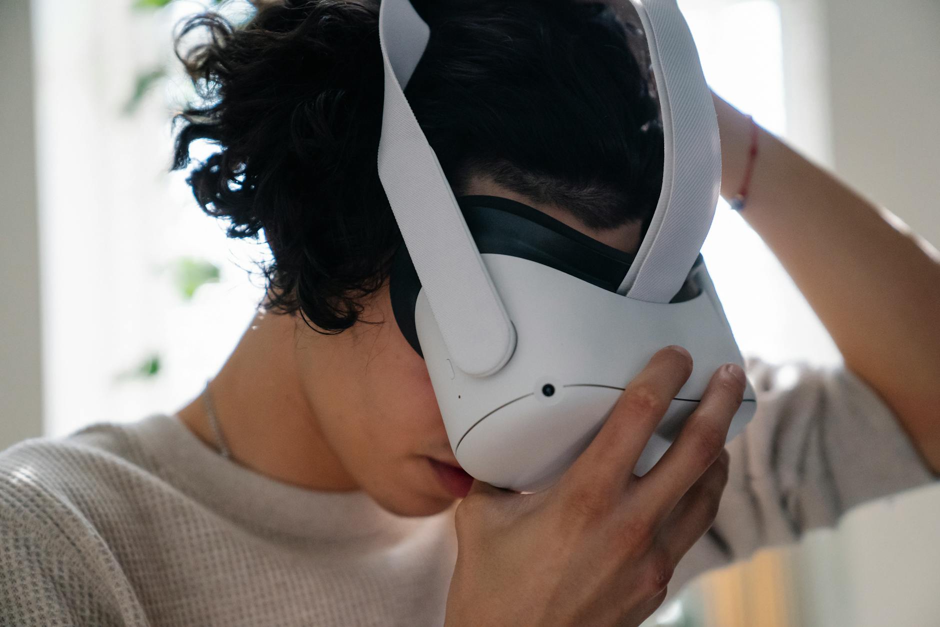 Person wearing VR headset experiencing immersive digital technology