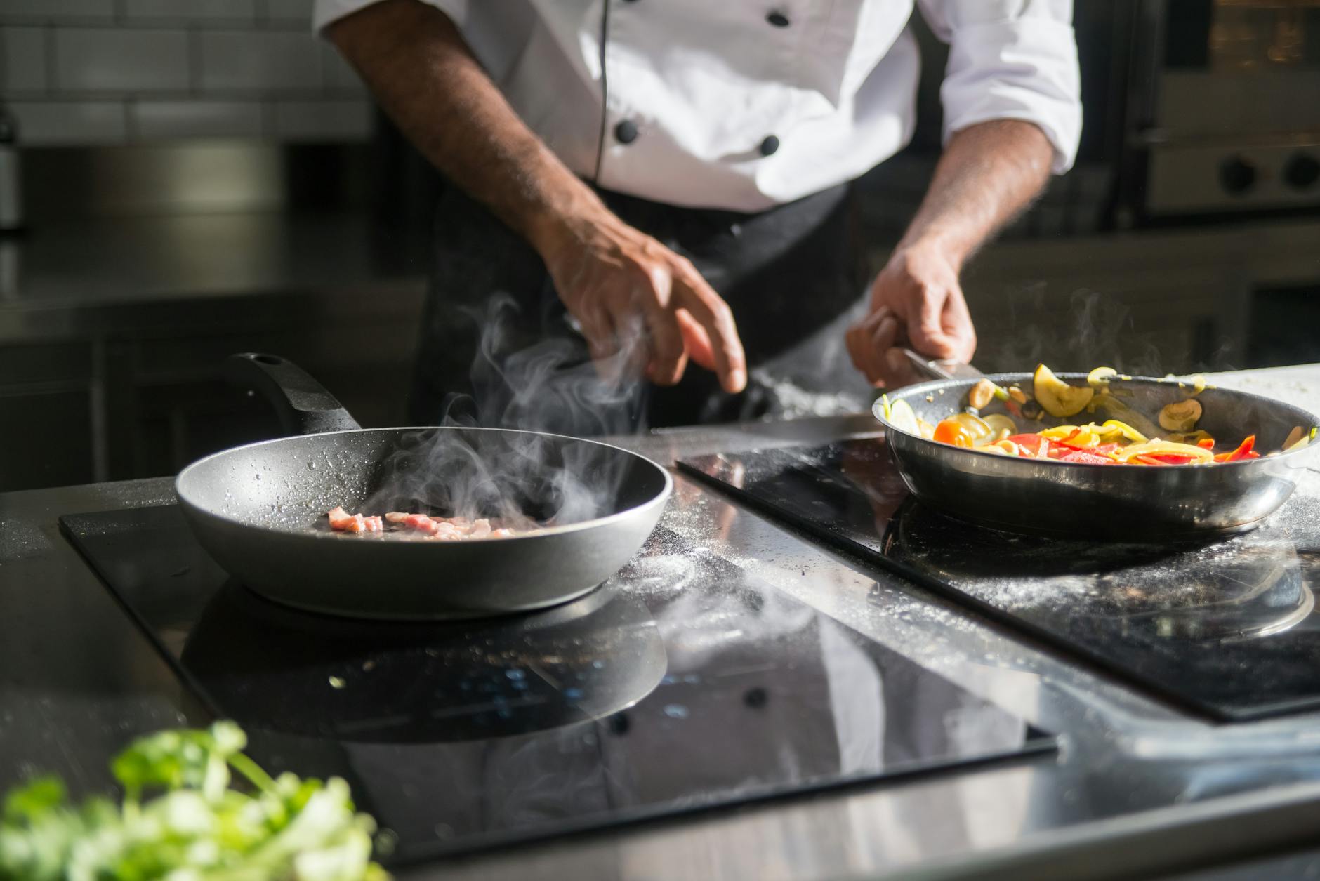 Professional chef preparing food in a kitchen environment