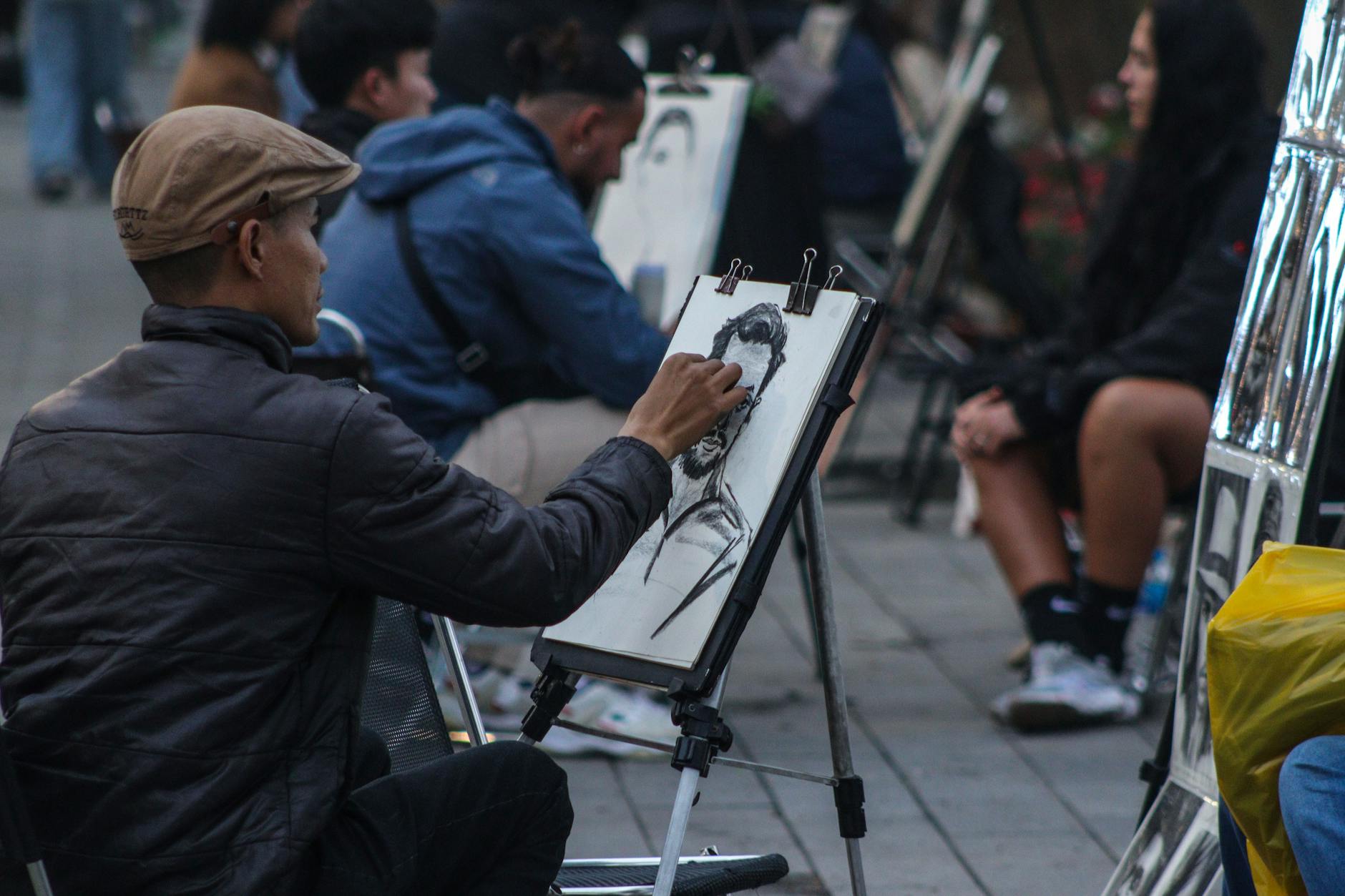 Close-up of hand sketching with stylus on digital drawing tablet