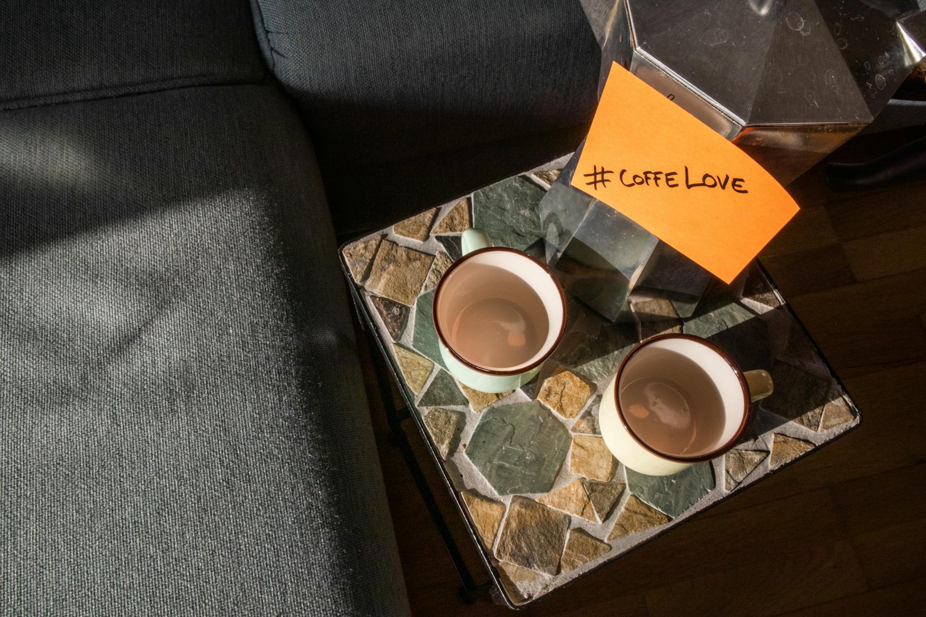 Sleek coffee table with glass top and wireless charging zones in modern living room