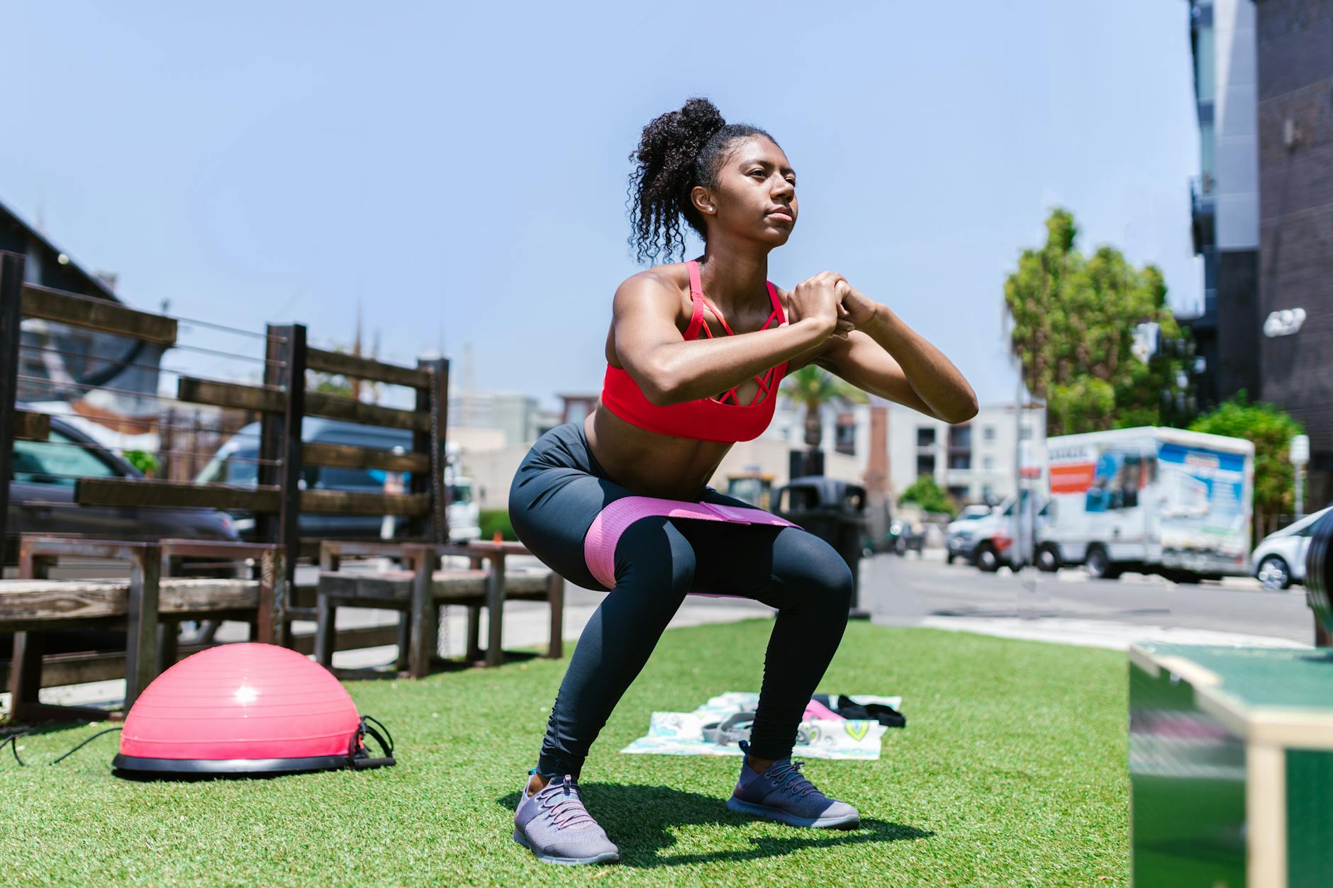 Woman doing workout exercises at home in fitness clothing