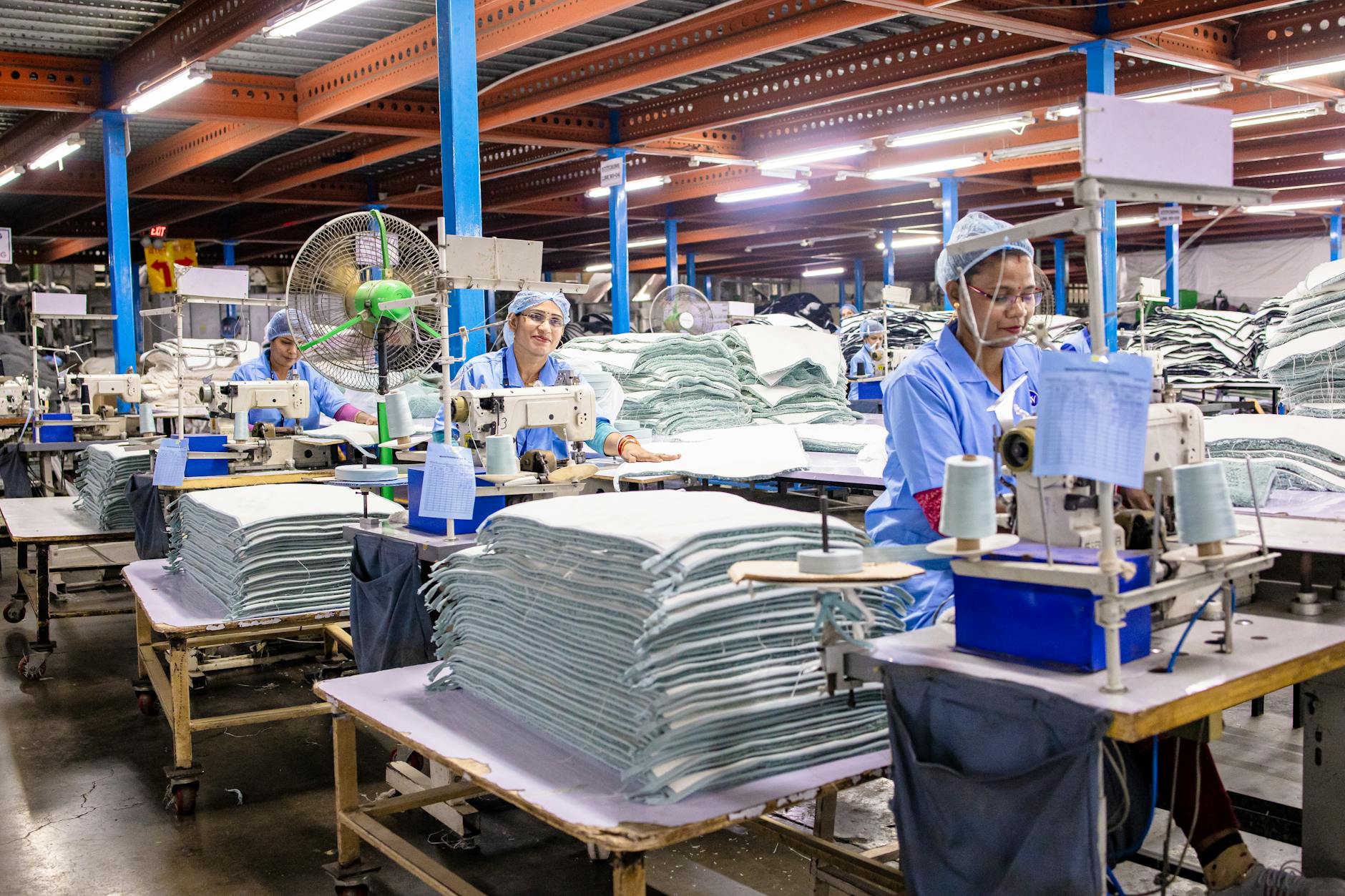 Manufacturing workers in footwear production facility showcasing sustainable supply chain practices