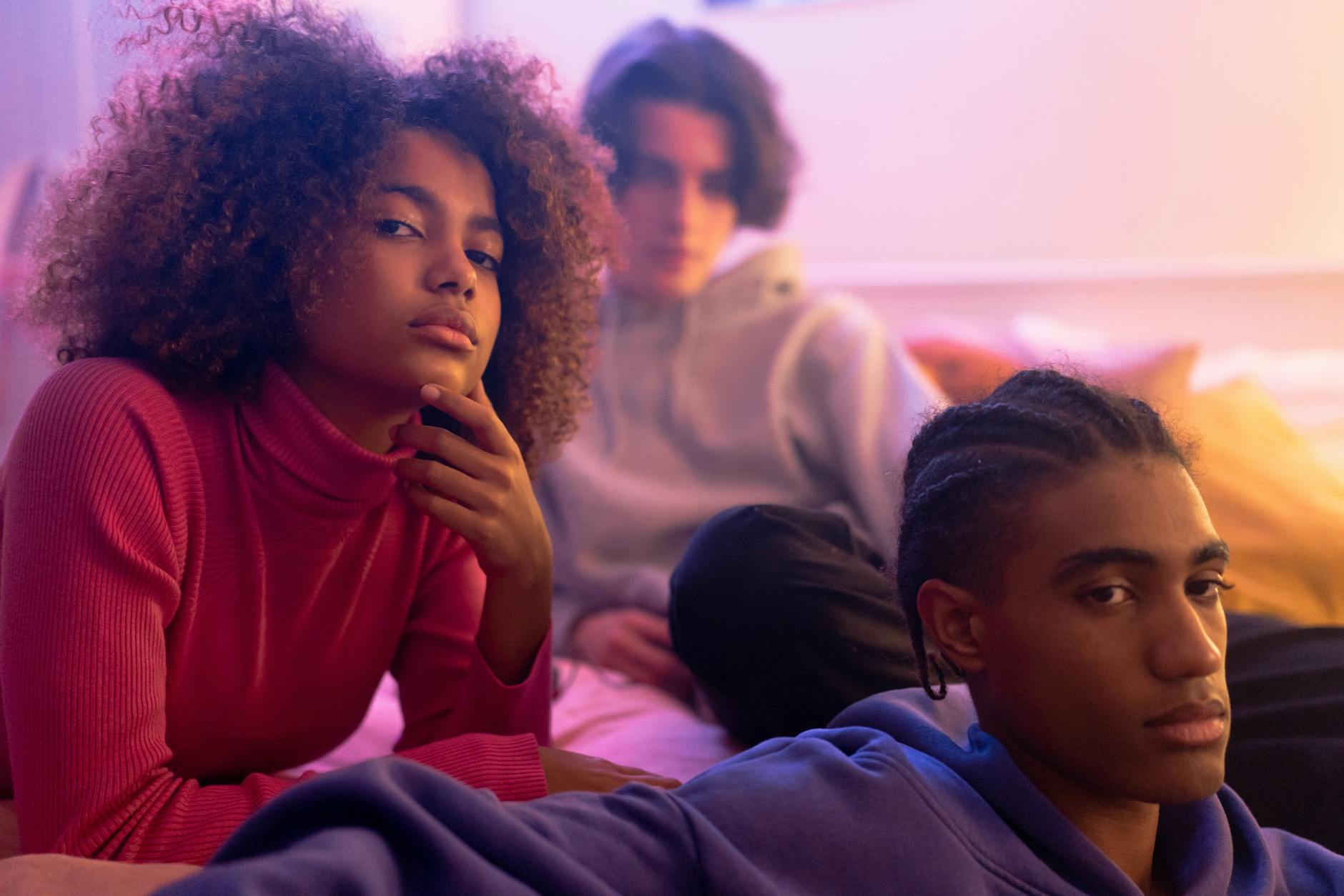 Group of diverse young adults having an engaged conversation in casual setting