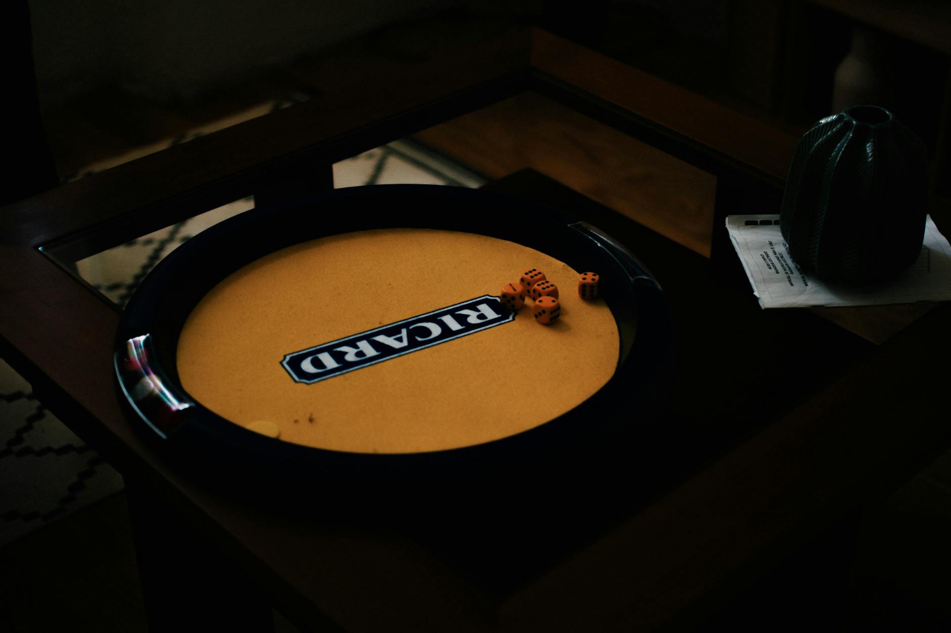 Colorful board games and game pieces spread across a wooden table