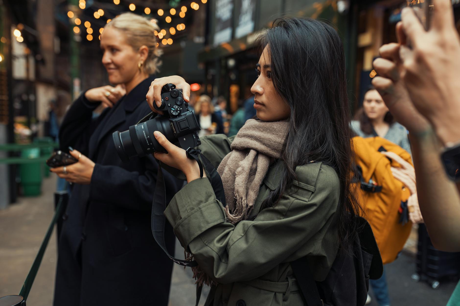 Person taking professional photos of vintage clothing for online resale