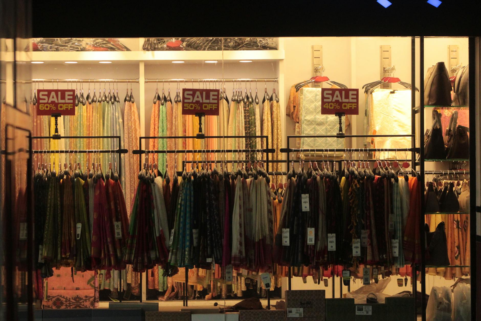 Interior of upscale fashion retail store with clothing displays