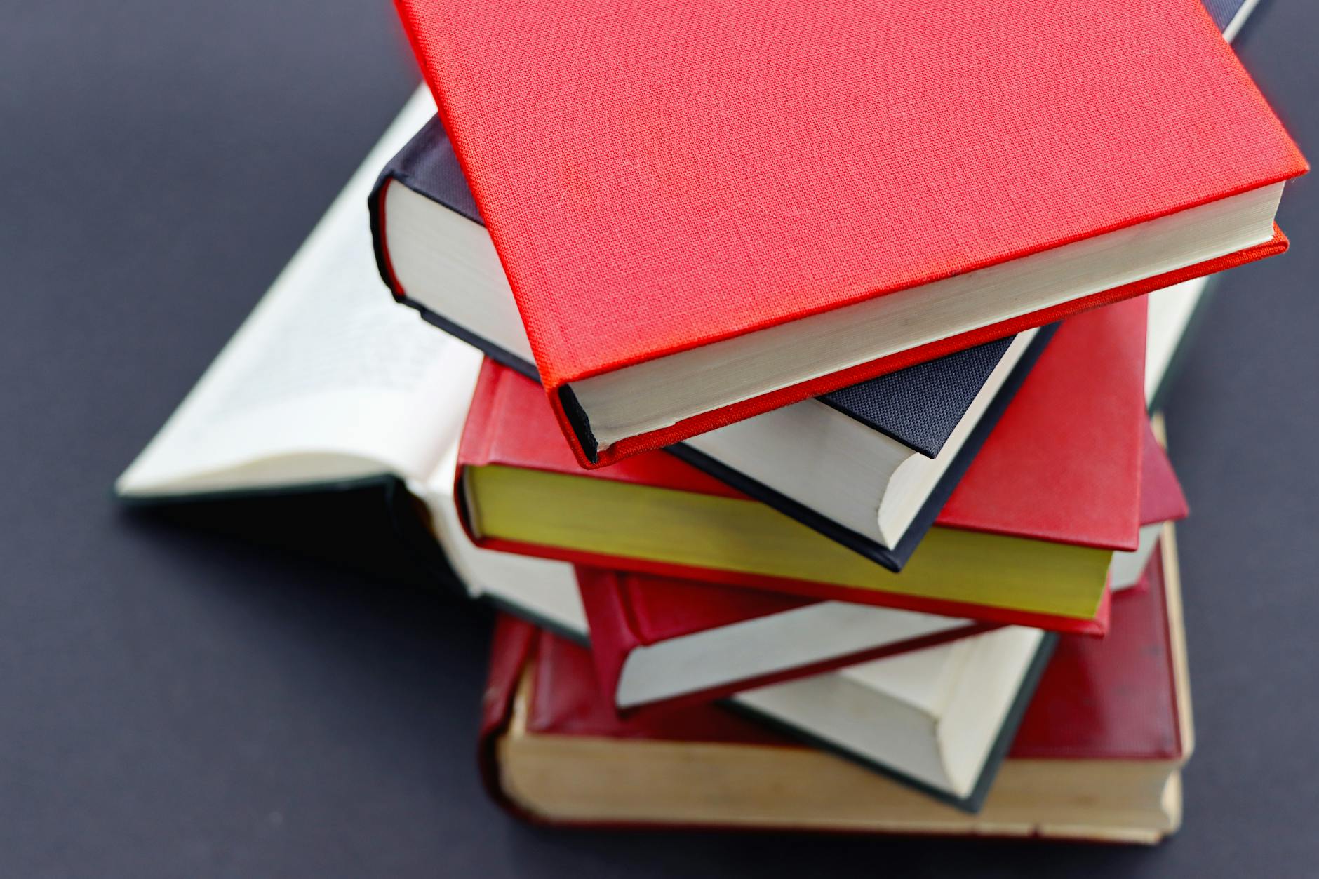 Stack of books representing traditional and digital publishing formats