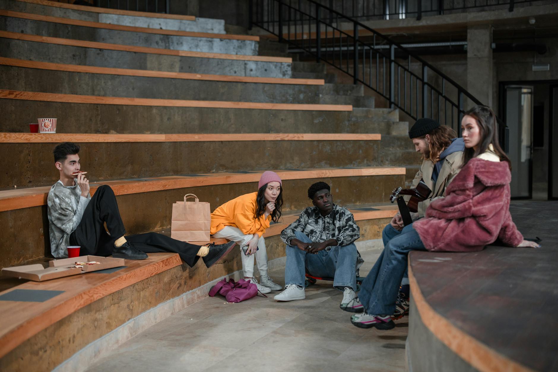 Group of young adults engaged in interactive technology experience