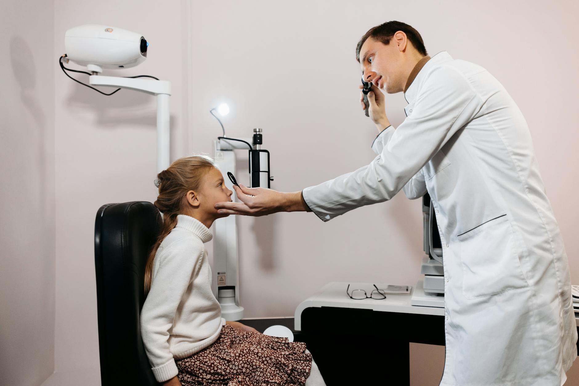 Modern eye examination equipment in a medical setting with diagnostic tools and monitoring devices