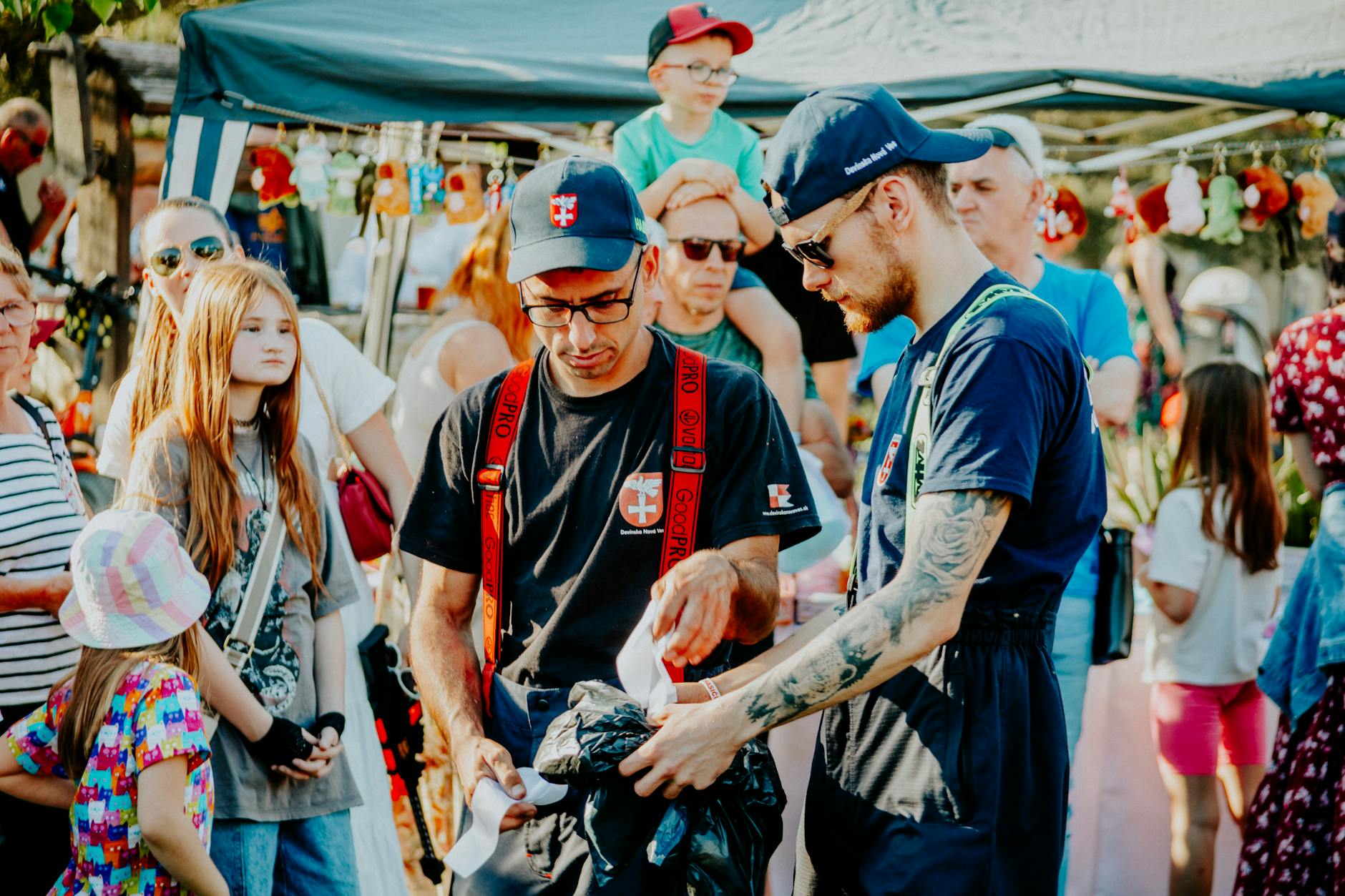 Families enjoying outdoor cultural festival with children in period costumes