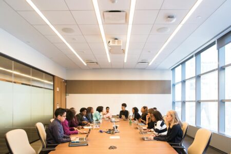 Modern corporate boardroom with executive chairs and conference table