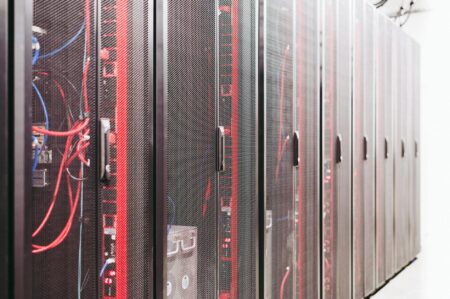 Server racks in modern data center facility with cooling systems
