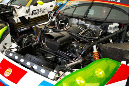Close-up view of modern racing engine components and hybrid systems