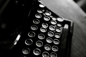 Vintage typewriter with paper showing creative writing process