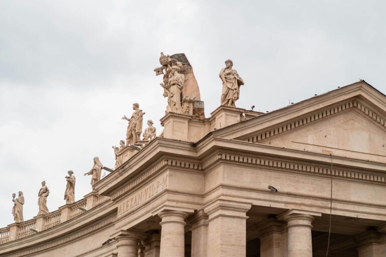 Exterior view of Vatican buildings representing institutional religious authority