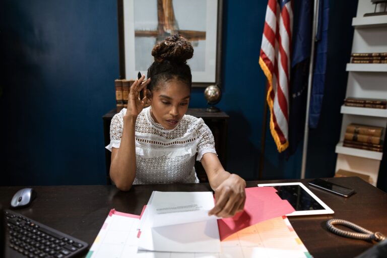Proposed new US funding rules: We can cancel any grant at any time Stack of federal government policy documents on a desk