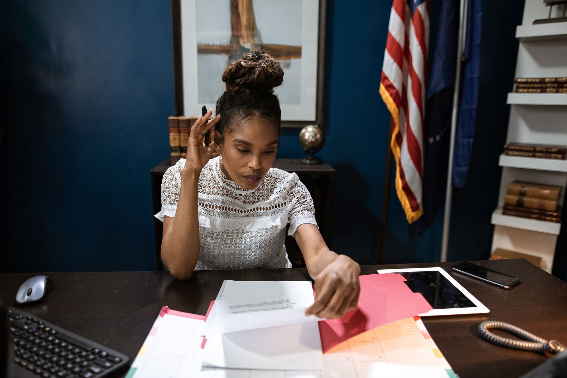Stack of federal government policy documents on a desk