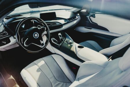 Modern luxury vehicle interior with leather seats and dashboard displays